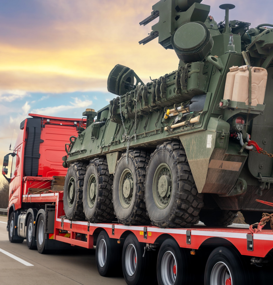 Truck with military vehicle